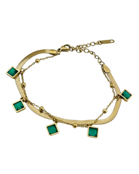 gold-plated bracelet featuring emerald-green charms